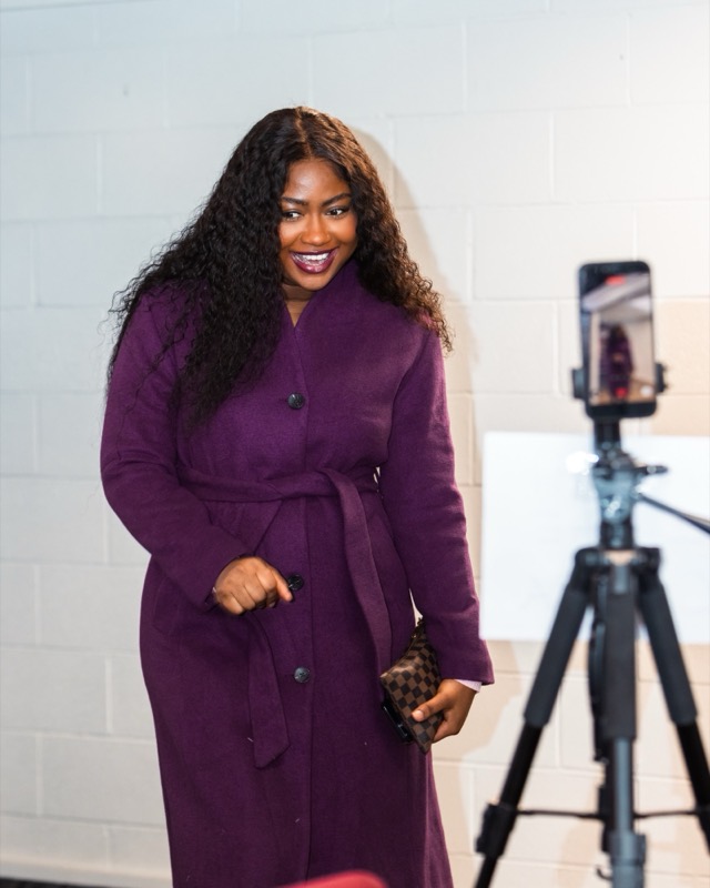 A smiling guest arriving at church